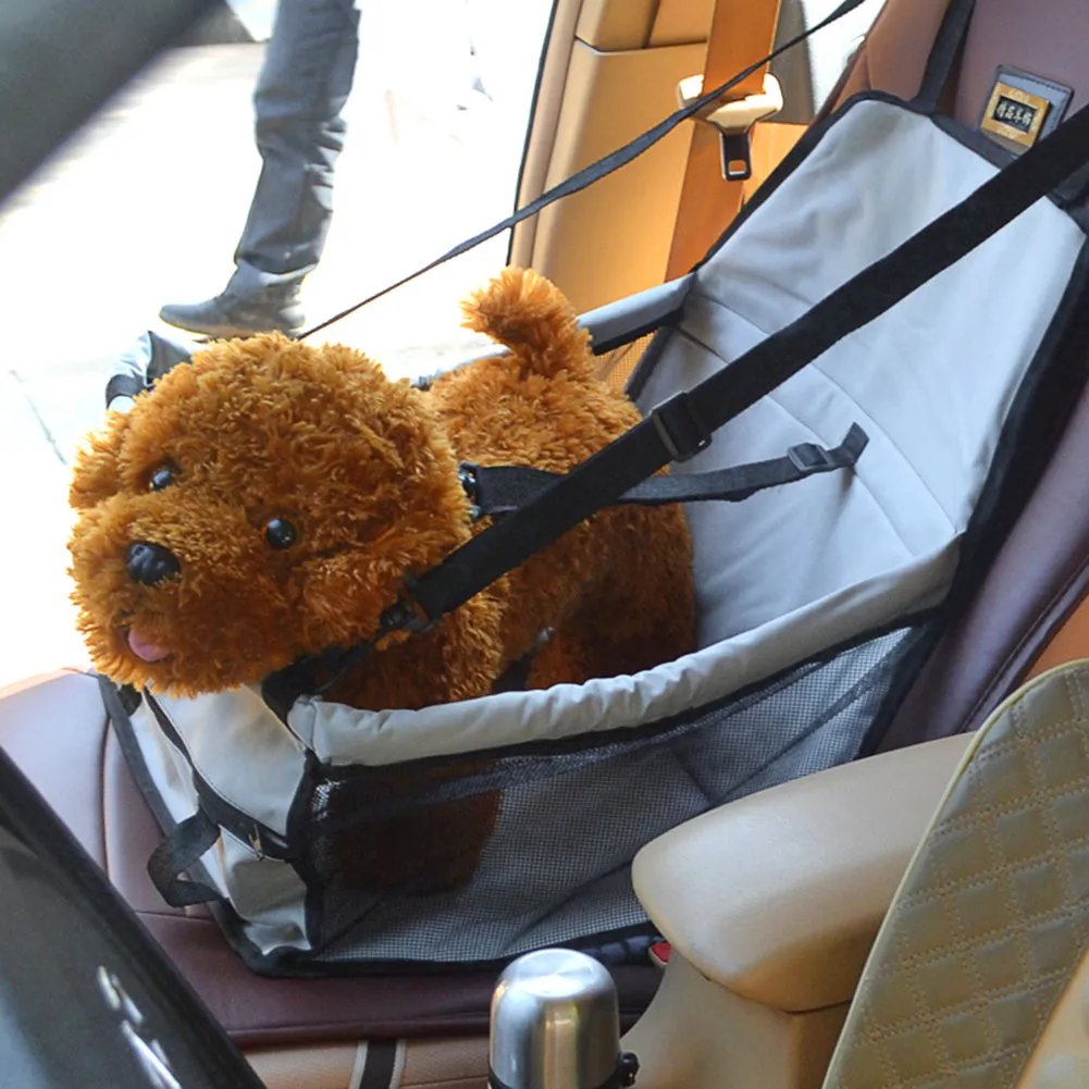 Waterproof and Foldable Car Booster Seat for Dogs with Clip-On Safety Leash and Storage Pocket.